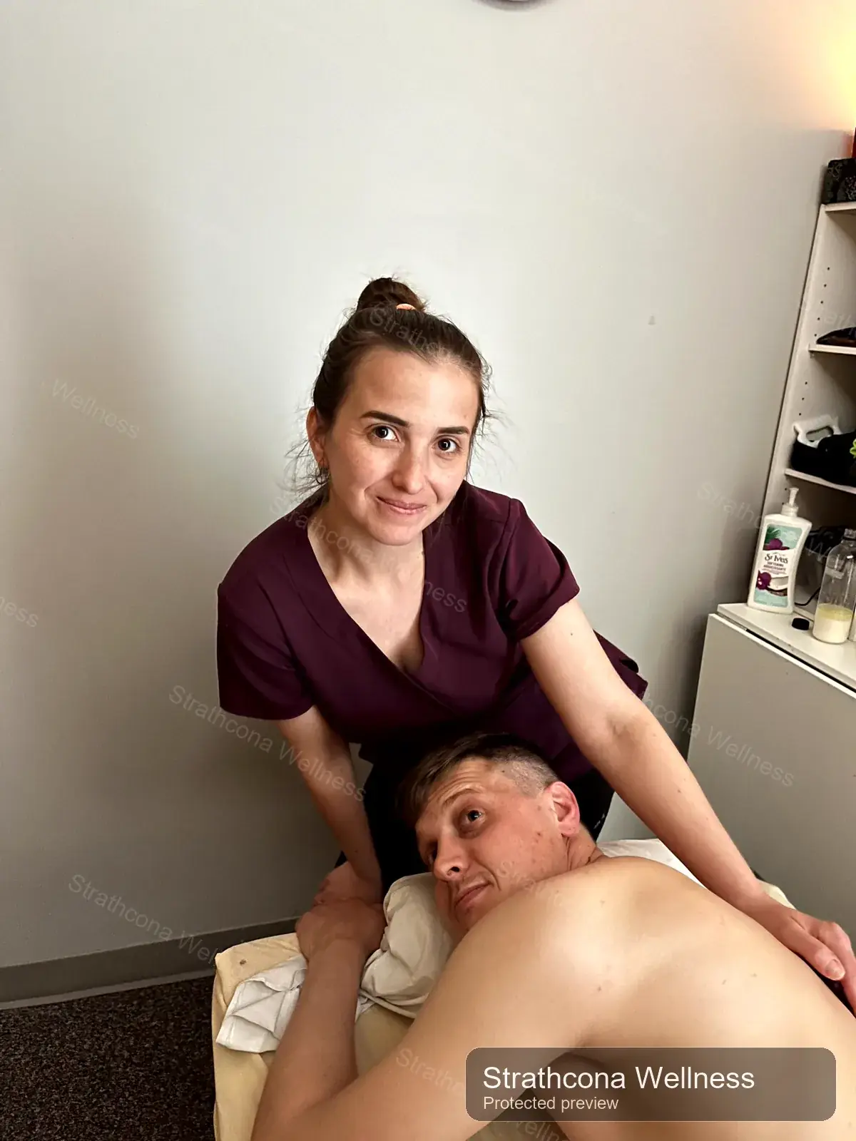 Provider and client during a massage therapy appointment